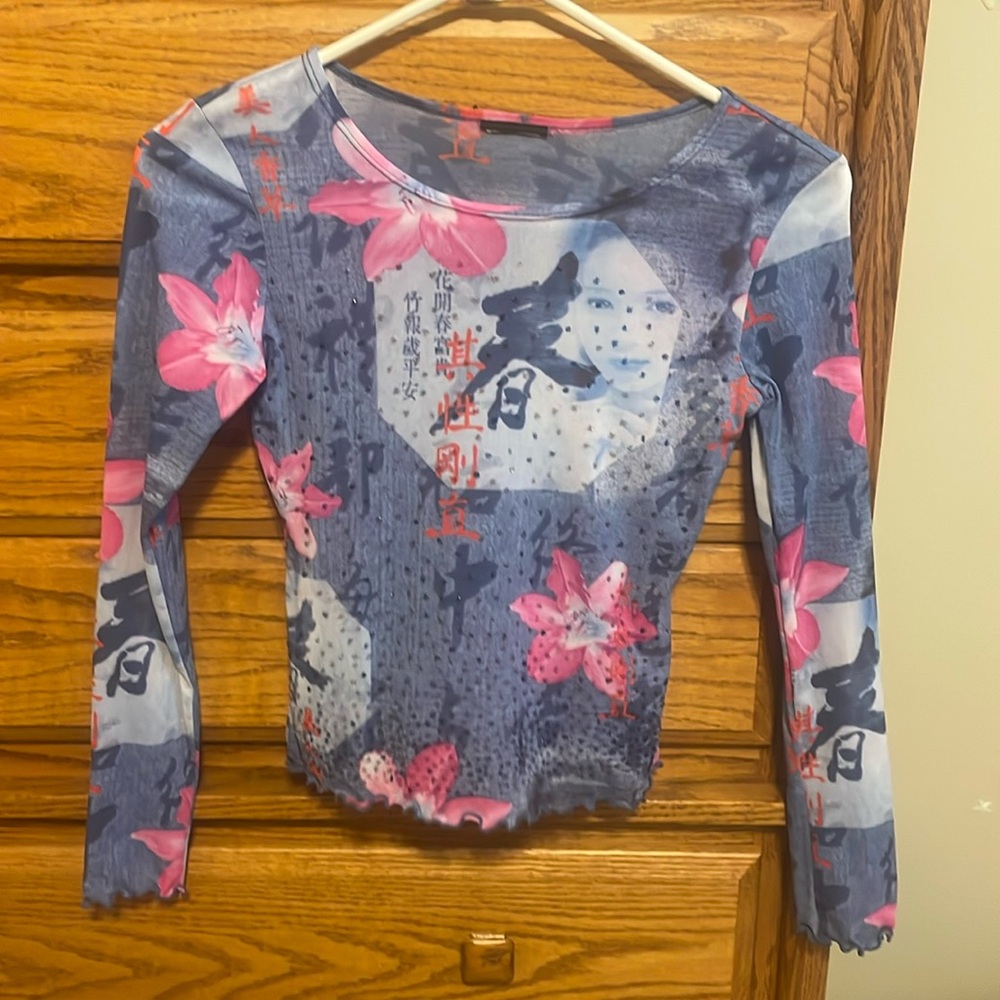 light blue and pink long sleeved cropped shirt
